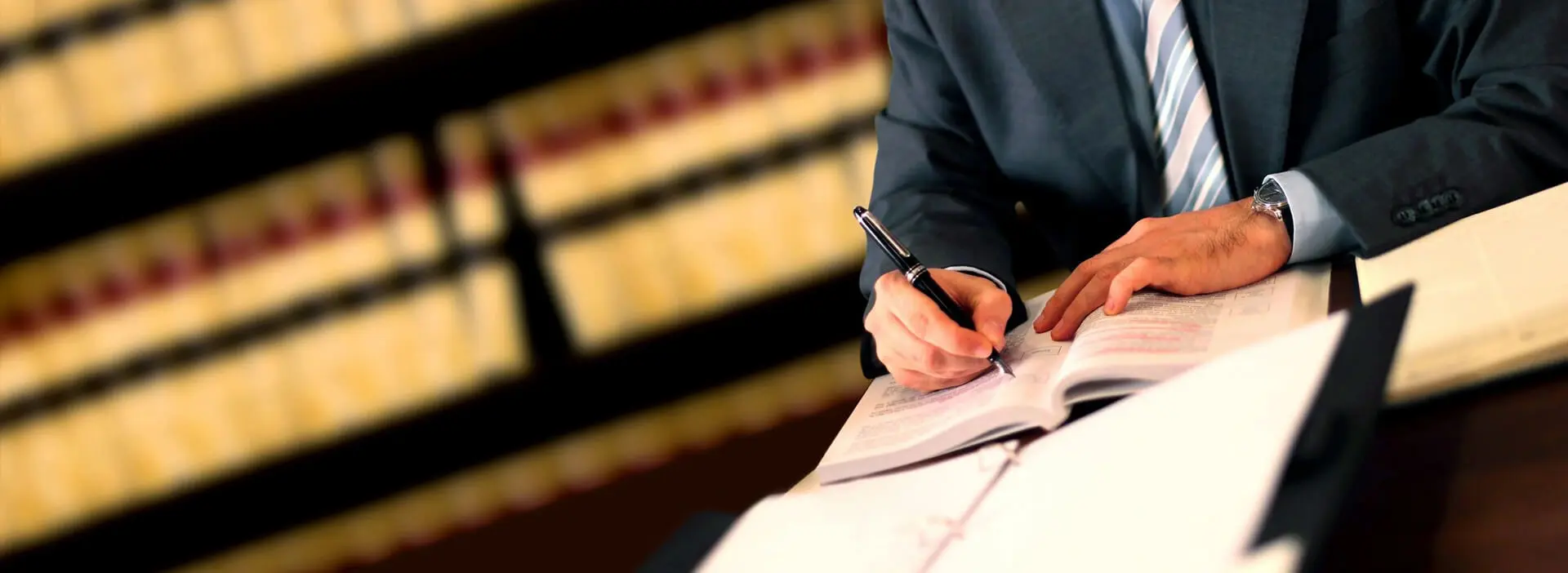 A lawyer writing at his book